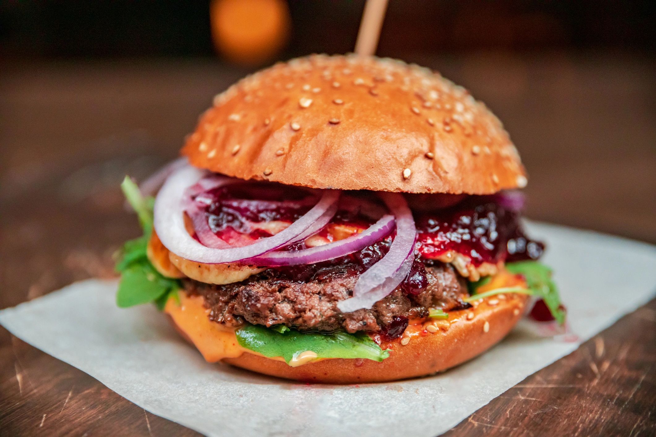 Burger platter with multiple burgers and vegetables