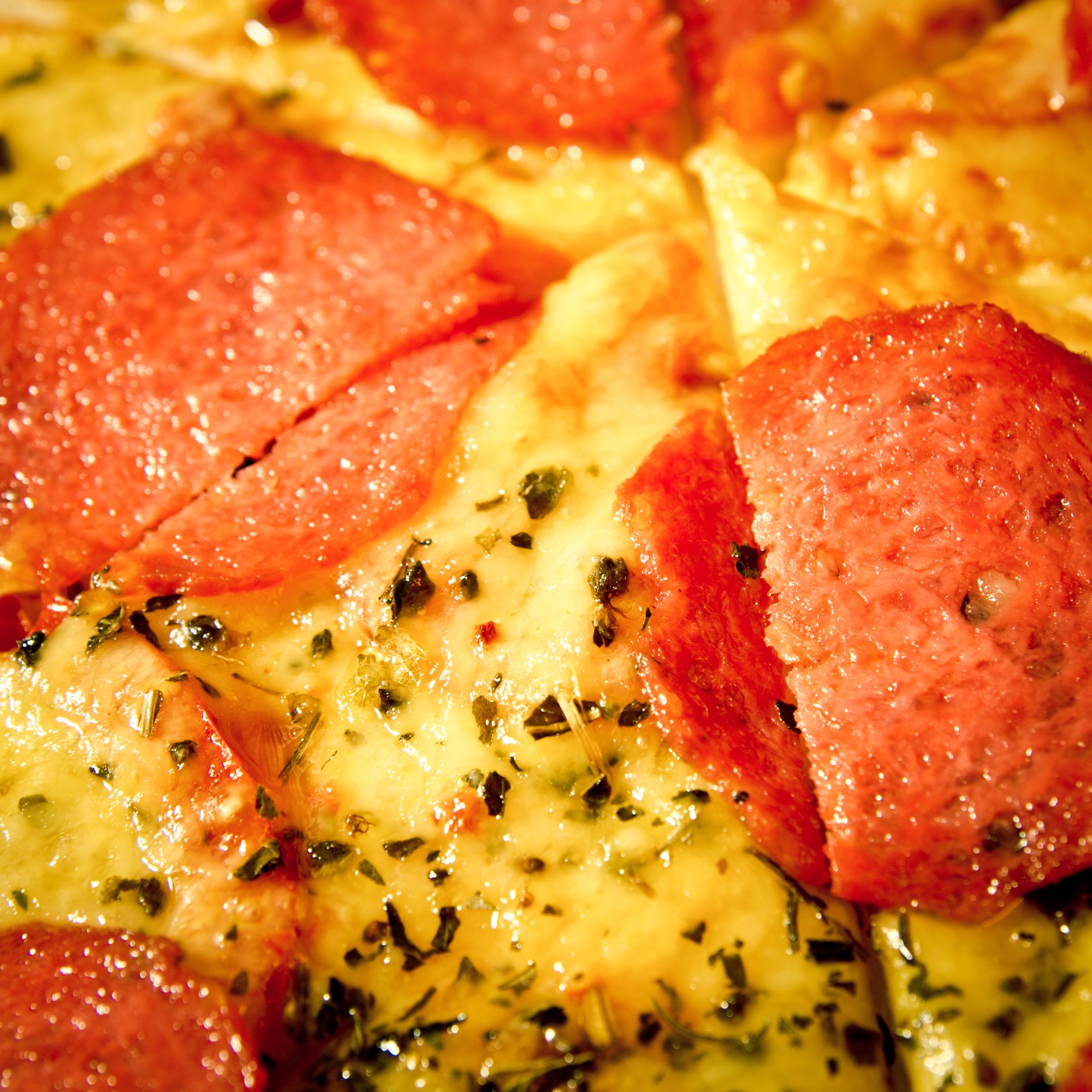 Close-up pizza with salami toppings